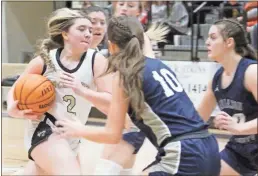  ?? Jeremy Stewart ?? Rockmart’s Sky Myers (left) drives to the inside against Haralson County players during the varisty girls’ game at Rockmart High School on Friday, Jan. 27.