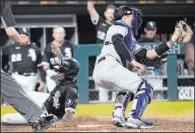  ?? Nam Y. Huh The Associated Press ?? Tim Anderson scores past Yankees catcher Kyle Higashioka in the ninth inning to end the White Sox’s 3-2 victory Saturday night.