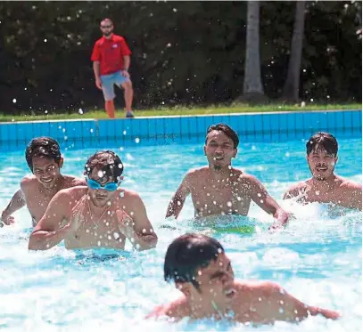  ??  ?? The national hockey players taking a dip at the MBI swimming pool in Ipoh yesterday. They will take on India in the Sultan Azlan Shah Cup today.