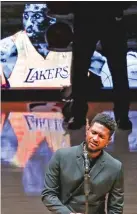  ?? RINGO H.W. CHIU/ASSOCIATED PRESS ?? Singer Usher performs ‘Amazing Grace’ on Friday in the Staples Center in Los Angeles during a Lakers pregame tribute to the late Kobe Bryant, who died Sunday along with eight others in a helicopter crash.