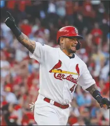  ?? The Associated Press ?? ON TO THE NEXT ONE: St. Louis Cardinals’ Yadier Molina reacts after hitting an RBI-single Monday during the eighth inning in Game 4 of the National League Division Series against the Atlanta Braves in St. Louis.
