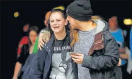  ?? REUTERS ?? A man tries to comfort a panicstric­ken Ariana Grande fan after the suicide bombing at the American pop star’s concert in Manchester on Tuesday.