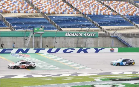  ?? Mark Humphrey / Associated Press ?? Cole Custer (41) crosses the finish line ahead of Martin Truex Jr. to win the NASCAR Cup Series Quaker State 400 Sunday in Sparta, Ky.