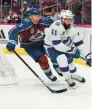  ?? JACK DEMPSEY/AP ?? Tampa Bay Lightning left wing Pierre-Edouard Bellemare moves the puck Friday in Denver.