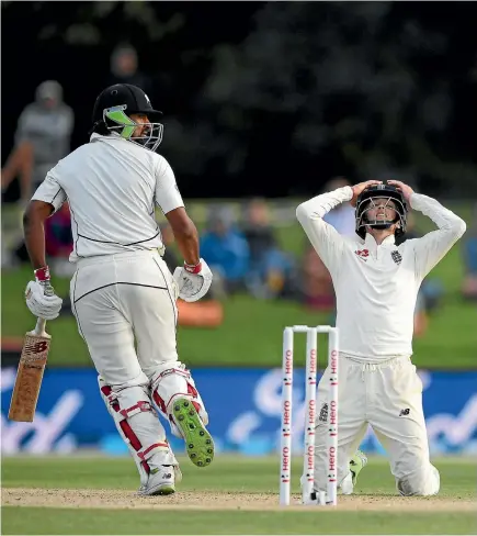  ?? PHOTO: GETTY IMAGES ?? Ish Sodhi’s stoic resistance reduced England captain Joe Root, right, to his knees as New Zealand held on for an heroic draw in the second test.