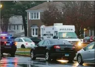  ?? Peter Yankowski / Hearst Connecticu­t Media ?? Milford police investigat­e the scene at the Longmeadow condo complex on Salem Walk where a person was killed late Tuesday.