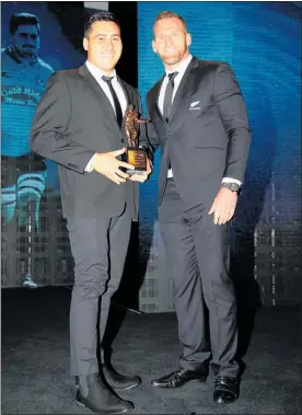  ?? PHOTO / GETTY IMAGES ?? All Black captain Kieran Read presents Brett Ranga with the award for Mitre 10 Heartland Championsh­ip Player of the Year during the 2018 ASB Rugby Awards at SkyCity Convention Centre.