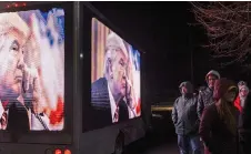  ?? — Adam Glanzman for The Washington Post ?? A truck displays images of former president Donald Trump outside a rally Friday in Concord.