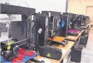  ?? COURTESY OF LAURA KIEF SHAFFER ?? Sixteen 3D printers run day and night and churn out about 500 masks and 300 shields a week.