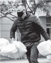  ?? ?? Julio Rodriguez at work delivering meals during the pandemic.
