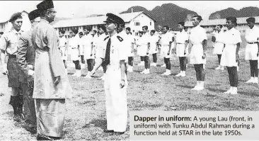  ??  ?? Dapper in uniform: a young Lau (front, in uniform) with Tunku abdul Rahman during a function held at STaR in the late 1950s.