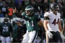  ?? CHRIS SZAGOLA — THE ASSOCIATED PRESS ?? Carson Wentz (11) reacts after running for a against the Bears Sunday in Philadelph­ia. first down