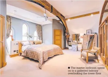  ??  ?? The master bedroom opens on to a galleried balcony overlookin­g the lower floor