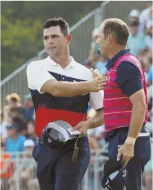  ?? AP PHOTO ?? HE’S YOUR LEADER: Gary Woodland (left) is congratula­ted by Sergio Garcia following the first round of the PGA Championsh­ip yesterday in St. Louis.