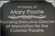  ?? PHOTO COURTESY OF THE COLONIAL THEATRE ?? Long-time Colonial Theatre Executive Director Mary Foote left her position July 31. More than 100 people came together that day to say goodbye. During the event, Foote was presented with a plaque, seen here to mark her 20 years of service. She also received a painting by local artist Teresa Haag, that was a gift from the Colonial staff.