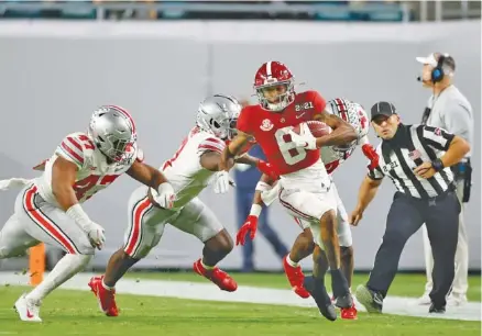  ?? CRIMSON TIDE PHOTOS ?? Alabama senior receiver DeVonta Smith had 12 first-half catches for 215 yards and three touchdowns during Monday night’s 52-24 pummeling of Ohio State.