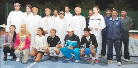  ??  ?? WINNERS in various categories pose for a group photo along with Oman Tennis Associatio­n and tournament officials at the end of Oman Internatio­nal ITF Under-18 Championsh­ips at the Sultan Qaboos Sports Complex yesterday.
ABDULMALIK ADVANCES
RESULTS...