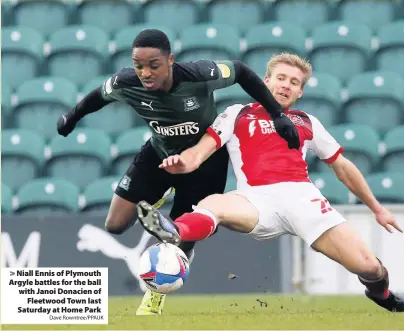  ?? Dave Rowntree/PPAUK ?? Niall Ennis of Plymouth Argyle battles for the ball with Janoi Donacien of Fleetwood Town last Saturday at Home Park