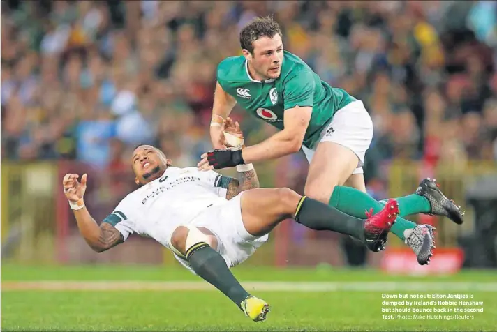  ?? Photo: Mike Hutchings/Reuters ?? Down but not out: Elton Jantjies is dumped by Ireland’s Robbie Henshaw but should bounce back in the second Test.