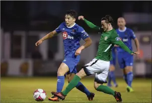  ??  ?? Dylan Barnett of Waterford is tackled by Daniel McKenna of Bray Wanderers.