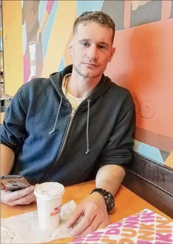  ?? Photos provided by Kevin Flood ?? Dan Flood, photograph­ed by his father in 2019 at a Dunkin Donuts in Albany. He was sober, in good health and working as a janitor in the Empire State Plaza after years of addiction and a dozen failed treatment programs in five states.