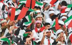  ?? AFP ?? UAE supporters cheer for their team prior to the Gulf Cup final against Oman in Kuwait City on Friday.