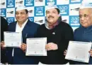  ?? PIC/NAVEEN SHARMA ?? Newly elected Delhi Rajya Sabha MPS Sushil Gupta, Sanjay Singh and ND Gupta with their certificat­e during the press conference at party office in New Delhi on Monday