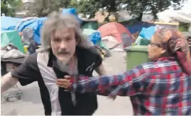  ??  ?? John McEachern approaches a CTV cameraman in May 2016.