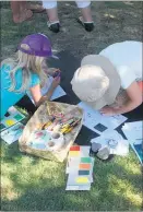  ??  ?? Children enjoying colouring in.