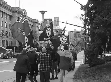  ?? Youtube ?? Douglas Pearson is seen, fifth from the left in blue and yellow ski jacket, in a video of a Southern Ontario Skinheads rally in 2013 in London, Ont.