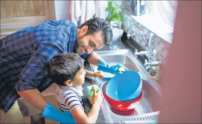  ?? GETTY IMAGES / ISTOCK ?? As everyone pitches in to take on new chores, children have benefited from seeing gender roles ease in the household. n