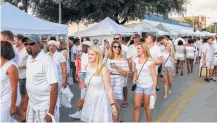  ?? Gary Fountain ?? Celebrate summer by strolling along 19th Street in the Heights on Saturday during White Linen Night.