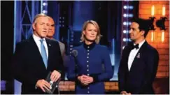  ??  ?? Kevin Spacey, from left, Michael Kelly and Robin Wright appear as their characters from "House of Cards" as they present Lin-Manuel Miranda with the envelope for best musical.