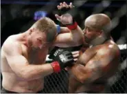  ?? JOHN LOCHER — THE ASSOCIATED PRESS ?? Daniel Cormier, right, fights Stipe Miocic during a heavyweigh­t title mixed martial arts bout at UFC 226, Saturday in Las Vegas.