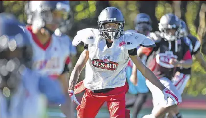  ?? HYOSUB SHIN / HSHIN@AJC.COM ?? Torre Sumlin, 17, practices at Therrell High School on Wednesday. Torre struggled in school for years but wasn’t tested and diagnosed with autism until 10th grade. He plays on the Therrell football team and was the honorary captain for the APS Autism...