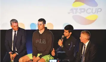  ?? AFP ?? ATP President Chris Kermode (left), US player John Isner (centre) and Serbia’s Novak Djokovic speak at the launch of the new ATP Cup tournament in London yesterday.