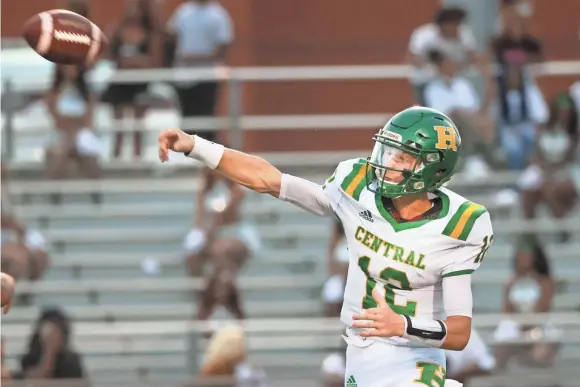  ?? PHOTOS BY JOE RONDONE/THE COMMERCIAL APPEAL ?? Central’s Law Wright throws the ball during their game Friday at Cordova High School.