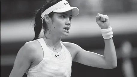  ?? REUTERS ?? Emma Raducanu reacts during her fourth-round match against Australia’s Ajla Tomljanovi­c at Wimbledon on Monday. The British teenager was forced to withdraw after falling ill when a set and 3-0 down, clutching her stomach and gasping for breath.