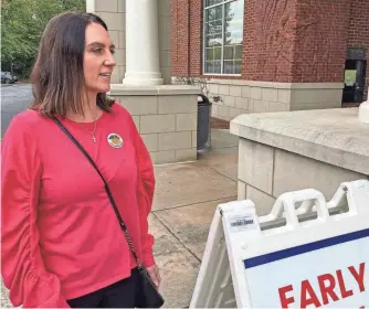  ?? ?? Stacy Skinner, a city councilwom­an in John’s Creek, Ga., leaves her early voting location after casting her ballot for her reelection on Oct. 19. Skinner has accepted an endorsemen­t from Veterans for Trump. But she’s careful about how she uses it. The dynamics show how national political fault lines are filtering down to local government and campaigns.