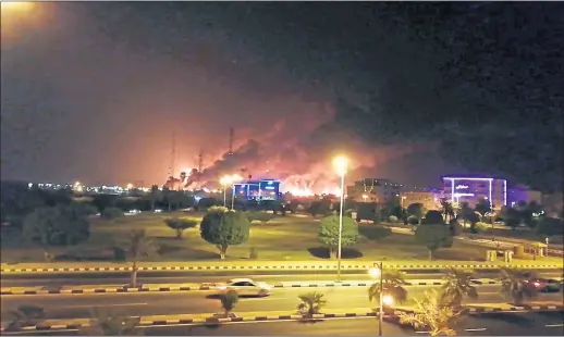  ??  ?? Abqaiq, in Saudi Arabia, the site of Aramco’s largest oil plant, is shrouded in smoke