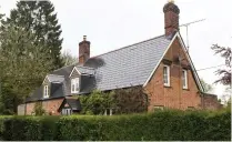  ?? ?? Historic: Moore’s £1million home. Right, builder Gary House with Aimee Burnett