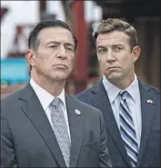  ?? John Gibbins San Diego Union-Tribune ?? DARRELL ISSA, left, has said he might challenge Rep. Duncan Hunter (R-Alpine), right, for his San Diego County seat. Hunter goes on trial in January.