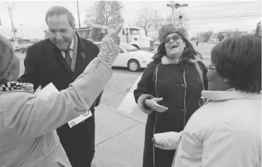  ?? PHIL CARPENTER/ THE GAZETTE ?? Stéphane Moraille, right, NDP candidate for the Nov. 25 byelection in Montreal’s Bourassa riding, campaigns with party head Tom Mulcair on Henri-Bourassa Blvd. The riding was left vacant after Denis Coderre stepped down as Liberal MP.