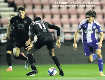  ??  ?? THE EYES HAVE IT: Wigan’s Oliver Crankshaw does battle with Vale’s Cristian Montano.