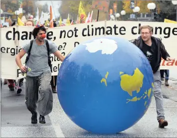  ?? PHOTO: EPA-EFE ?? Protesters roll a globe as they take part in the “Climate March” demonstrat­ion during the UN Climate Change Conference COP23 in Bonn, Germany, over the weekend. The conference runs from November 6-17 in Bonn.