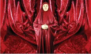  ??  ?? At Art Central, Anida Ali performed wrapped in a sequined red chador, questionin­g the politics of gender stereotypi­ng and exclusion.