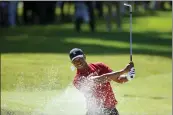  ?? RYAN KANG — THE ASSOCIATED PRESS FILE ?? Tiger Woods hits out of a greenside bunker on the 17th hole during the final round of the Genesis Invitation­al golf tournament at Riviera Country Club, on Feb. 16, 2020, in the Pacific Palisades area of Los Angeles.