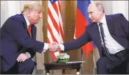  ?? Pablo Martinez Monsivais / Associated Press ?? U.S. President Donald Trump, left, and Russian President Vladimir Putin, right, shake hands at the beginning of a meeting at the Presidenti­al Palace in Helsinki, Finland on Monday.