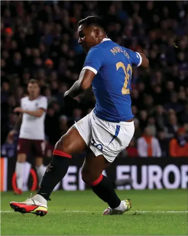  ?? ?? Alfredo Morelos scores the first of his brace as the Colombian striker helped new manager Giovanni van Bronckhors­t to victory in his first match in the Ibrox dugout, left