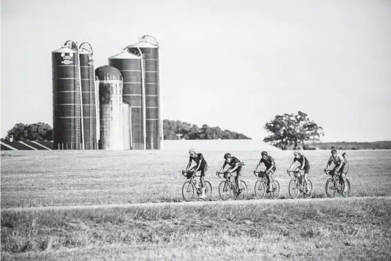  ?? JOEL CALDWELL ?? Bicyclists, including John Shackelfor­d, second from left, cycle through rural Georgia, visiting places associated with Black history as they ride from Mobile, Alabama, to Washington, D.C.